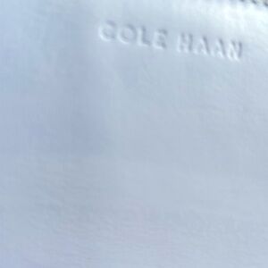 Cole Haan RFID protected, light blue leather zip around wallet, 16 slots.